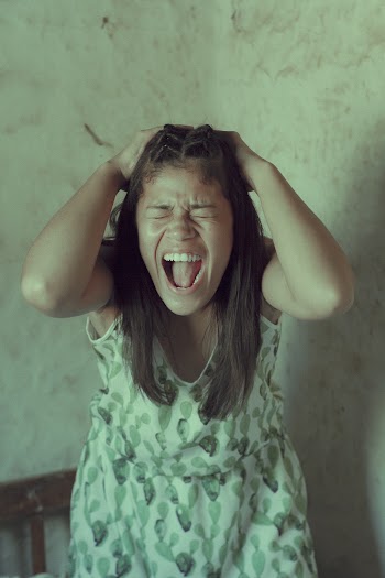 Screaming Woman Holding Her Head