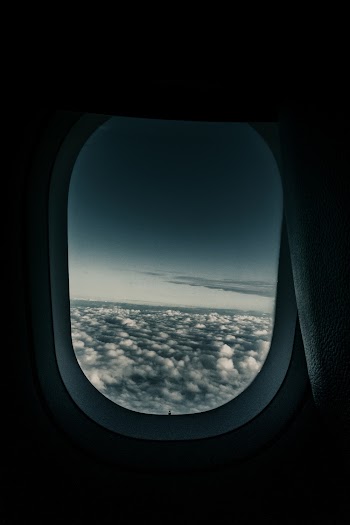 Sea of Clouds Through Airplane's Window