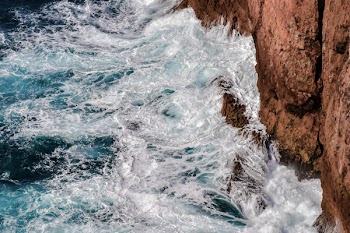 Sea Waves Crashing On Rock Formation
