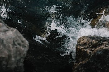 sea waves crashing on rocks