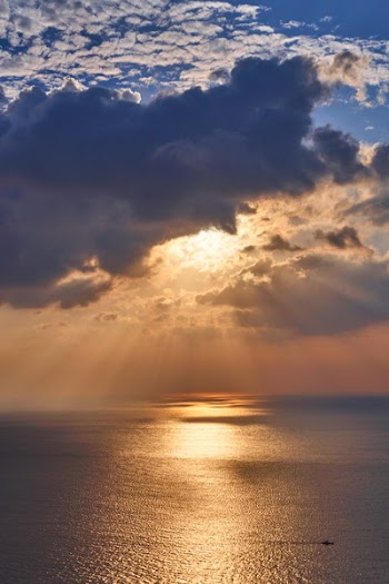 Seascape Under Sunlight Covered by Clouds