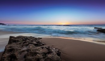 seashore under blue sky