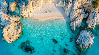 Secluded Mediterranean Beach Cove with Crystal Clear Waters