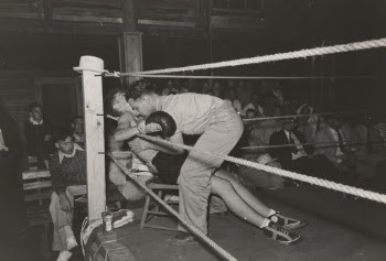 Second tending to boxer in corner of ring, Rayne, Louisiana.
1938. Photographer Lee Russell