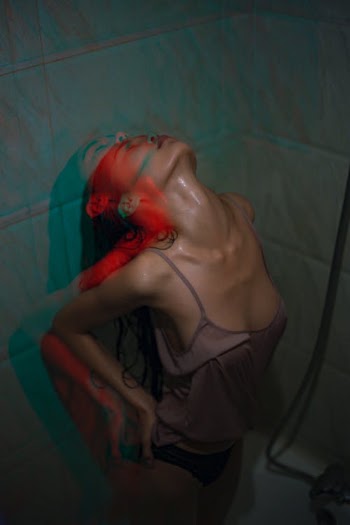 Seductive serious Asian woman in bathroom · Free Stock Photo