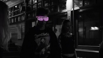 selected color of pink sunglasses wearing man in black jacket