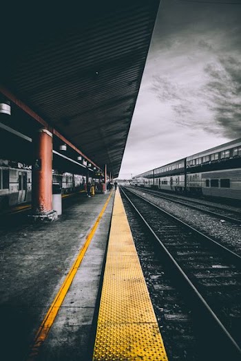 selective color photography of train railways