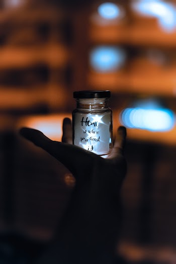 Selective Focus and Silhouette Photography of Jar \]