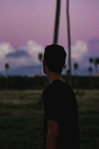 Selective Focus Back View Silhouette Photo of Man in Black T-shirt