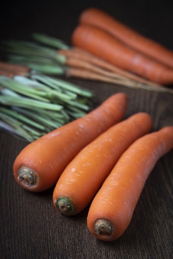 Selective Focus Close-up Photo of Carrots on Wooden Surface