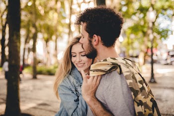 Selective Focus Close-up Portrait Photo of Hugging Couple