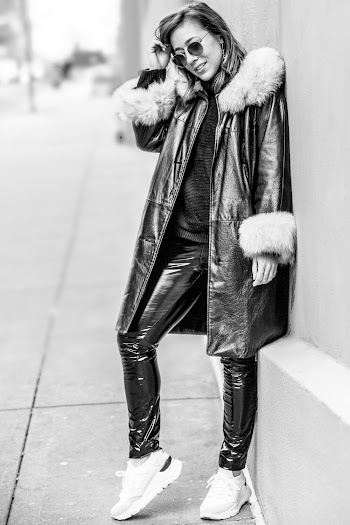 Selective Focus Grayscale Photo of Woman in Sunglasses Leaning on Wall Posing