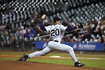 Selective Focus of Baseball Pitcher in 20 Jersey About to Throw Ball