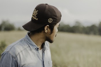 Selective Focus of Man Wearing Brown Cap