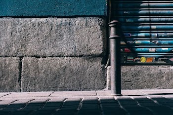 selective focus of metal bar during daytime