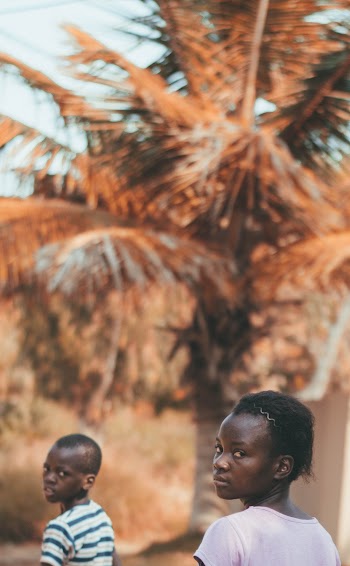 Selective Focus of Two Children Looking Back