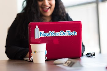 Selective Focus Phot of Woman Typing on Red Macbook