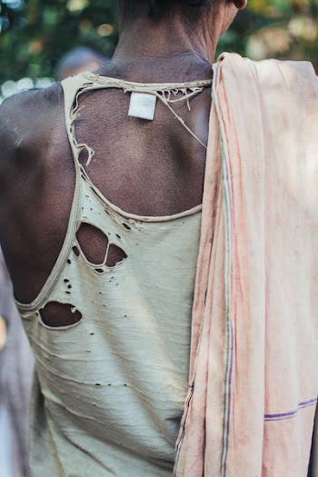 Selective Focus Photo Fo Person Wearing Distressed White Tank Top and Pink Scarf