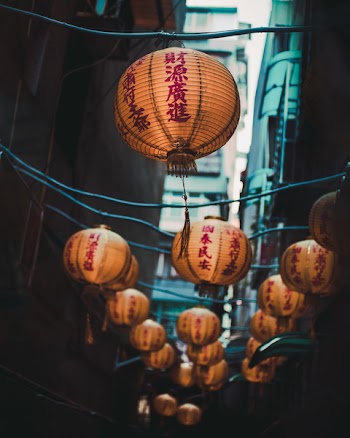 Selective Focus Photo of Brown Lanterns