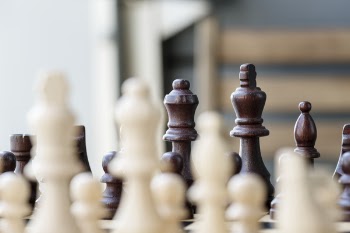 Selective Focus Photo of Chess Set