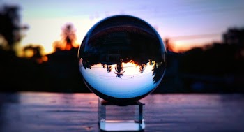 Selective Focus Photo of Clear Glass Ball