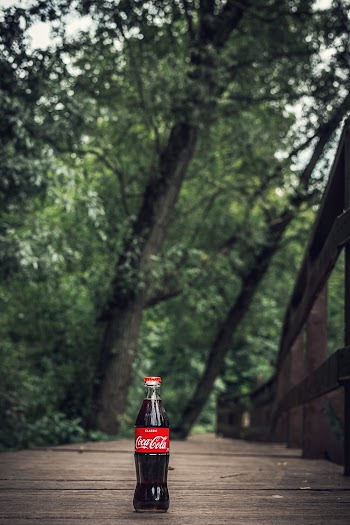 Selective Focus Photo of Coca-cola Bottle