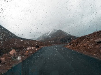 Selective Focus Photo of Glass With Raindrops