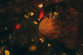 Selective Focus Photo of Gold Bauble on Christmas Tree