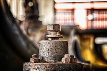 Selective Focus Photo of Gray Metal Bolts
