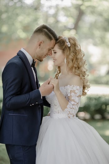 Selective Focus Photo of Groom and Bride Facing Each Other