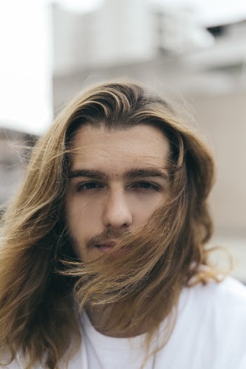 Selective Focus Photo of Long-haired Man