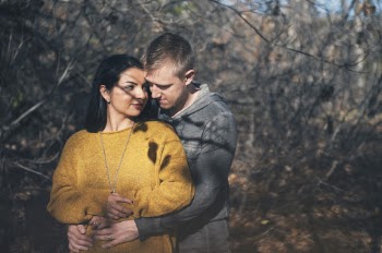 Selective Focus Photo of Man Hugging Woman from Behind
