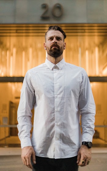 Selective Focus Photo of Man in White Dress Shirt Posing