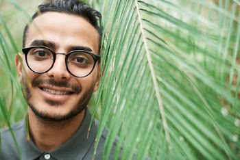 Selective Focus Photo of Man Wearing Eyeglasses