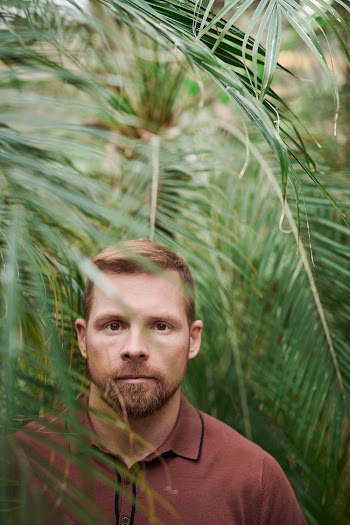 Selective Focus Photo of Man Wearing Polo Shirt