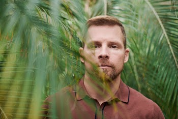 Selective Focus Photo of Man Wearing Polo Shirt