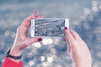 Selective Focus Photo of Person Holds White Samsung Galaxy Note Edge