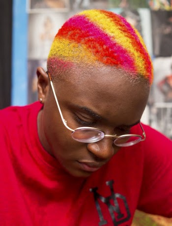 Selective Focus Photo of Person Wearing Red Crew-neck Top