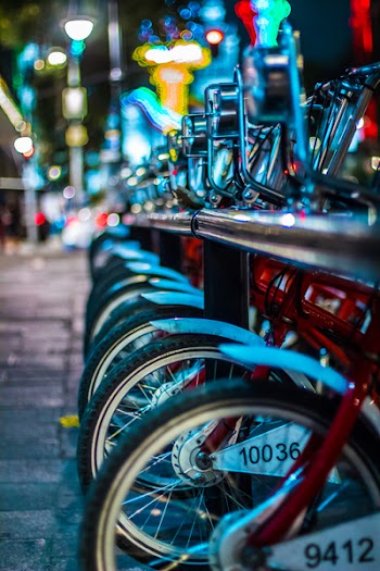 Selective Focus Photo of Red Bicycles