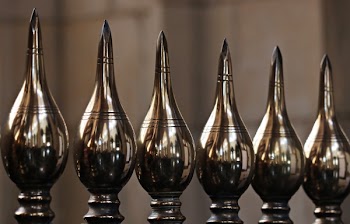 Selective Focus Photo of Six Silver Vases