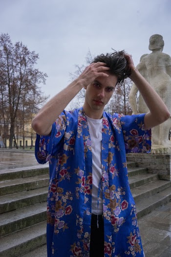 Selective Focus Photo of Standing Man Fixing Hair