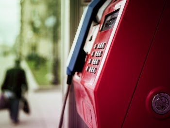 Selective Focus Photo of Telephone Booth
