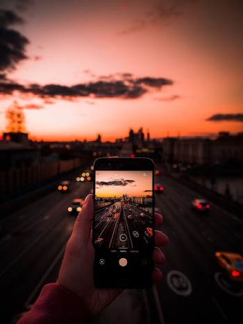 selective focus photo of vehicles on highway during golden hour