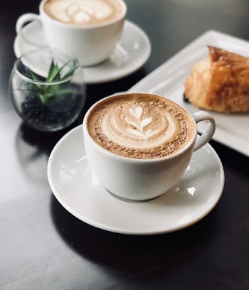 Selective Focus Photo of White Ceramic Mug on Saucer Filled With Espresso