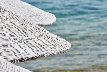 Selective Focus Photo of White Wicker Huts