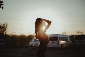 Selective Focus Photo of Woman Against Sun