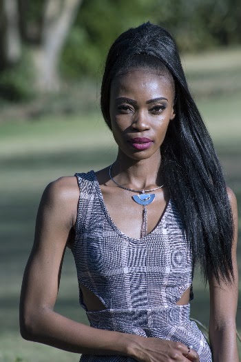 Selective Focus Photo of Woman In Gray Dress Posing