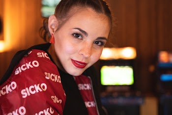 Selective Focus Photo of Woman in Red Sicko Zip-up Jacket