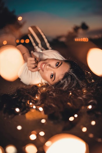 Selective Focus Photo of Woman Laying On Ground