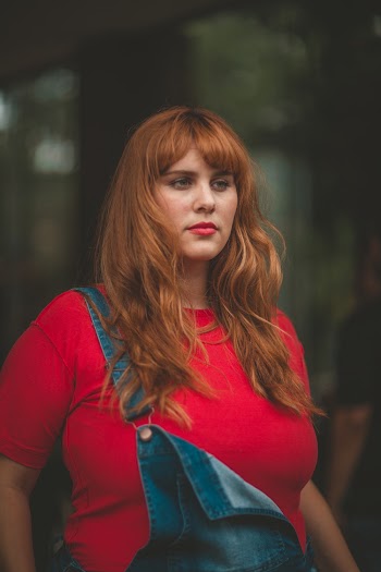 Selective Focus Photo of Woman Red T-shirt and Blue Dungaree
